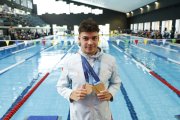 Kevin Teixeira amb les tres medalles d'or i la de bronze aconseguides als Jocs.