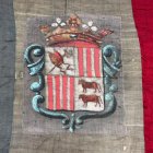 L'escut a la bandera d'Andorra restaurada.