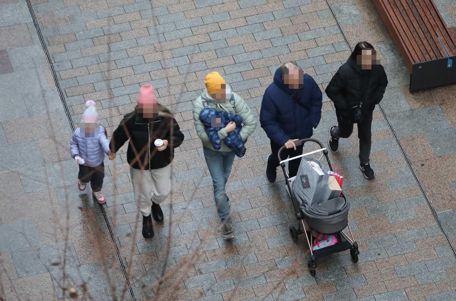 A family walking down the street.