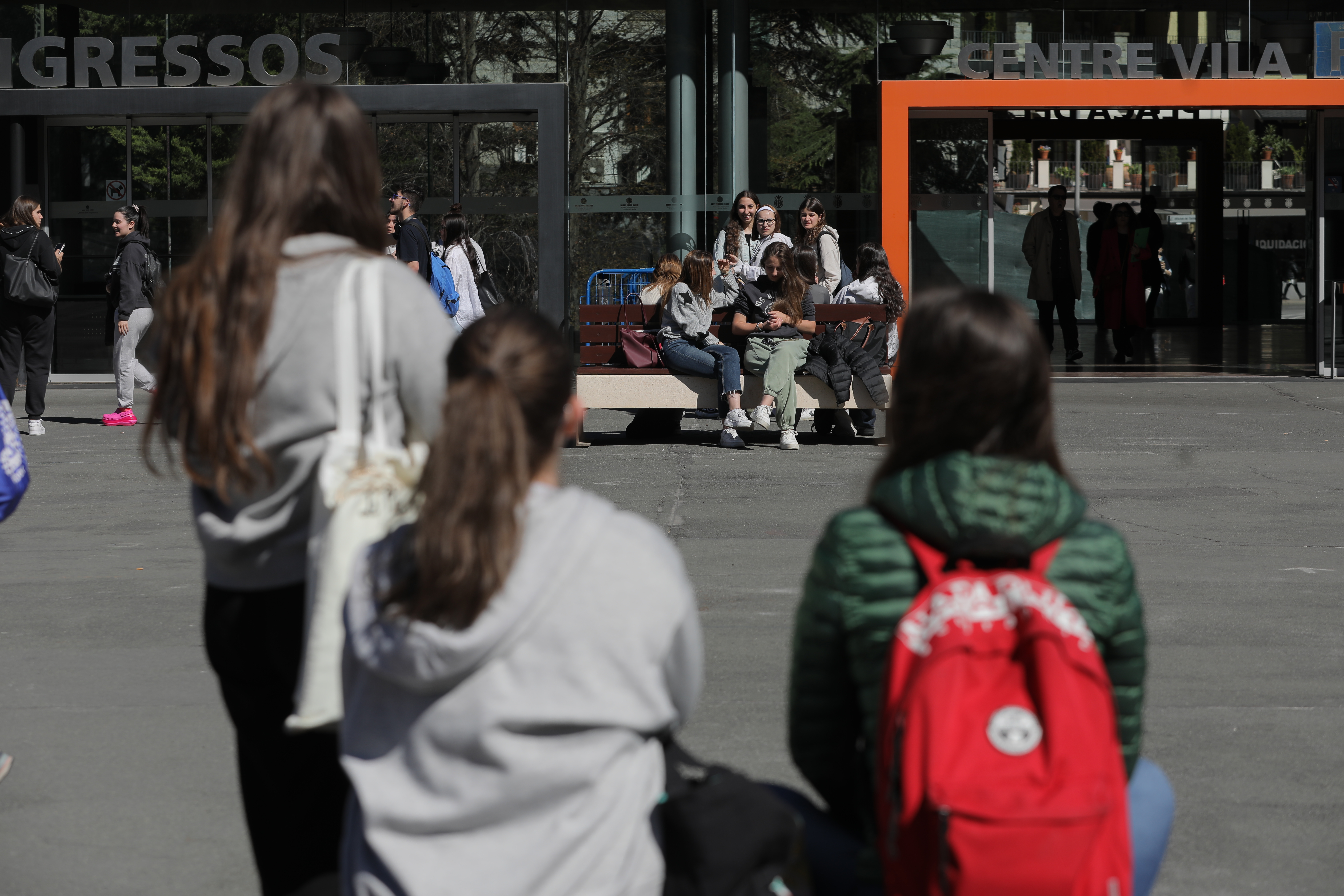 A group of young people in Plaça del Poble.