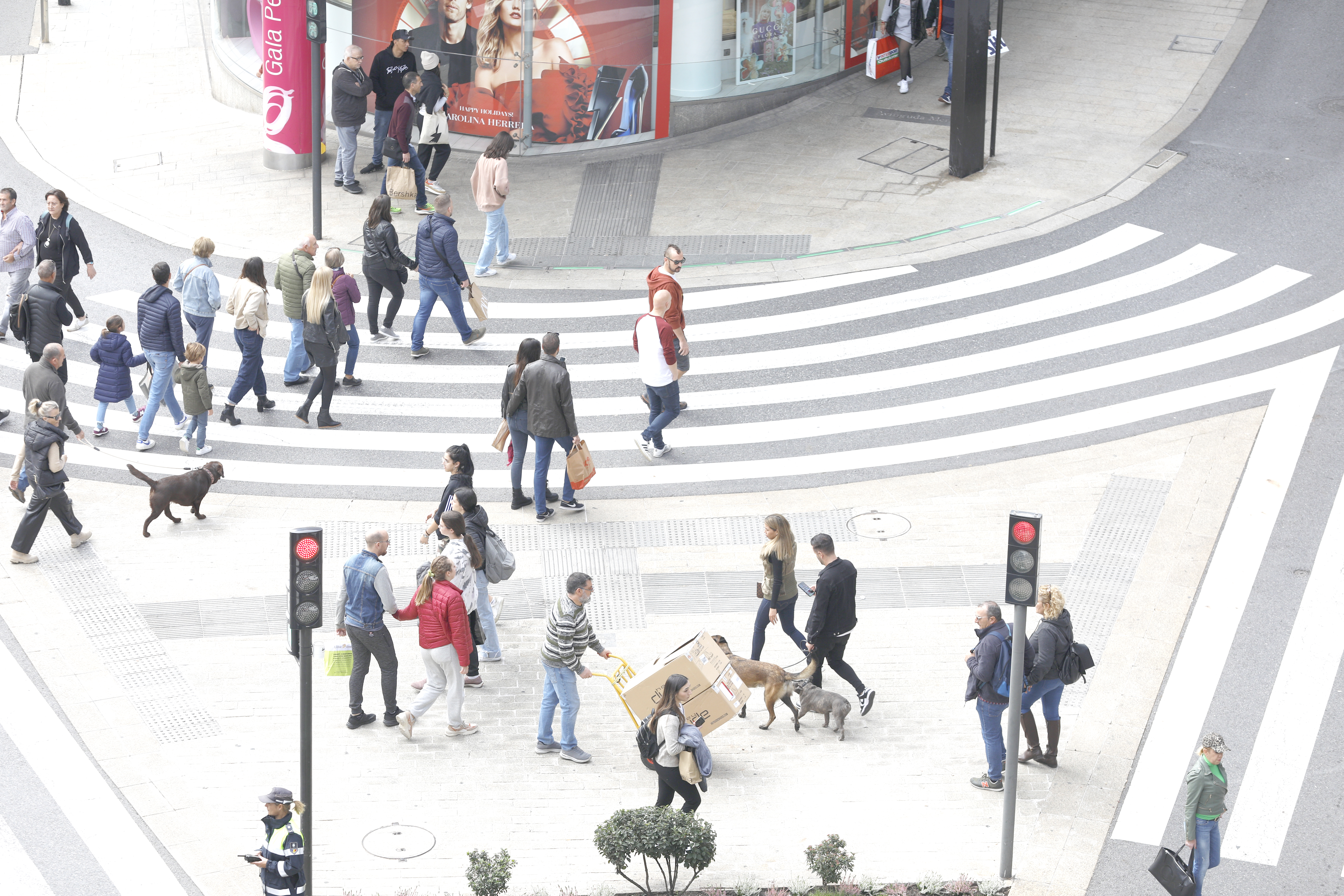 People crossing the Plaça de la Rotonda d'Andorra la Vella.