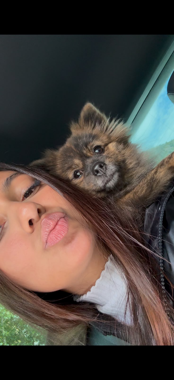 Julieth with her Pomeranian dog, 'Lulú'.